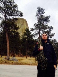 Gabriel S. with ropes on his shoulders and a peak in the background.