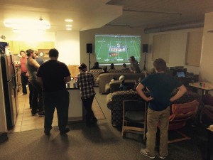 Photo of StepUP students watching the football game.