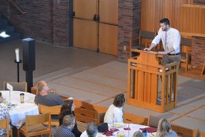 Caleb K. speaking at National Recovery Month's spirituality breakfast. Photo by Ricky T.