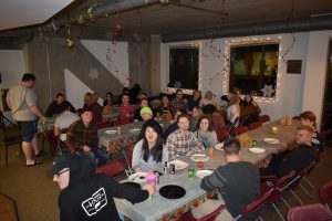StepUP students sitting for thanksgiving dinner