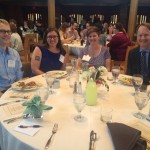 Guests seated around a table
