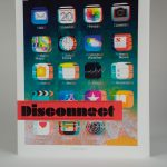 Blurry iPhone image with the word "Disconnect"
