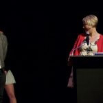Photo of Christian J and Kristin Wilcox on stage