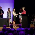 Photo of Sarah M. receiving her medallion form Kristin Wilcox